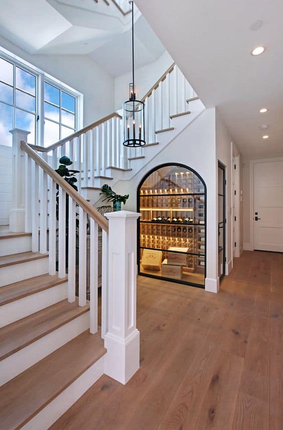 Bright staircase with wine storage alcove.