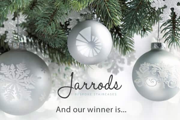 Silver ornaments on Christmas tree branches.