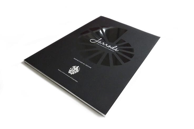 Black brochure with a logo and elegant design.