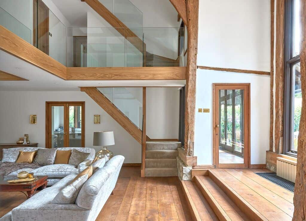 Modern interior with wooden floors and staircase.